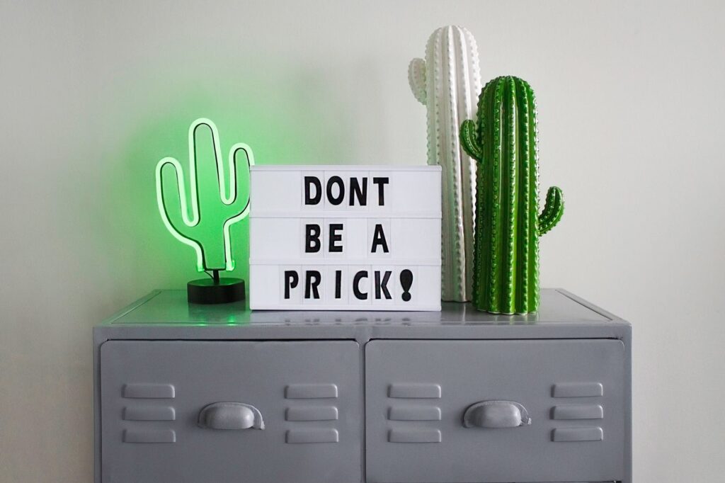 green and white cactus table decor on gray steel file cabinet
